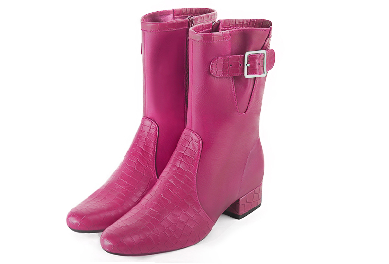 French elegance and refinement for these fuschia pink dress booties, with buckles on the sides, 
                available in many subtle leather and colour combinations. This high boot with its side zip will allow you to put a pair of jeans inside.
The outsole is made of rubber.  
                Matching clutches for parties, ceremonies and weddings.   
                You can customize these buckle ankle boots to perfectly match your tastes or needs, and have a unique model.  
                Choice of leathers, colours, knots and heels. 
                Wide range of materials and shades carefully chosen.  
                Rich collection of flat, low, mid and high heels.  
                Small and large shoe sizes